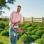 Man mowing lawn in the Gainesville summer heat